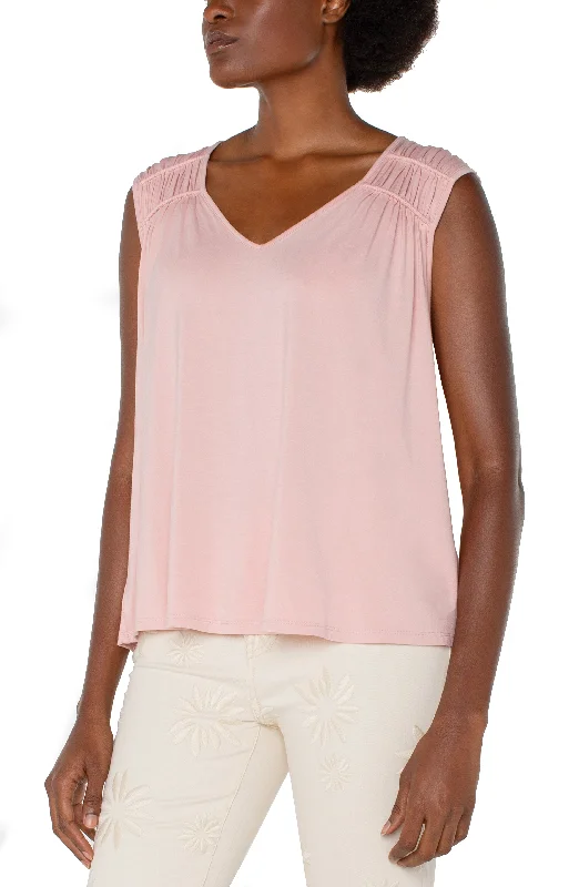 women's tops for those who want to wear versatile pieces that can be dressed up or downSLEEVELESS SHIRRED DETAIL KNIT TOP